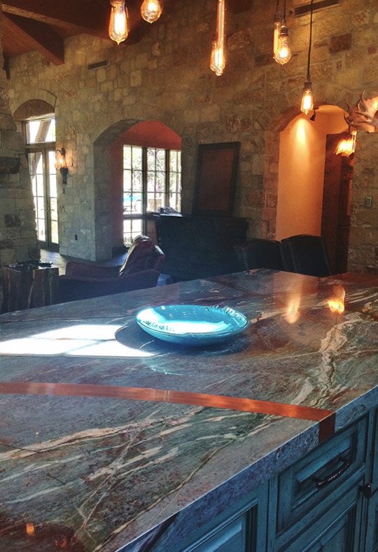 Eat-in kitchen - large rustic eat-in kitchen idea in Austin with an undermount sink, granite countertops and an island