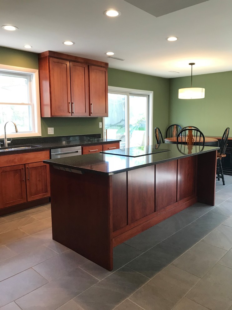 Example of a mid-sized urban l-shaped ceramic tile and gray floor eat-in kitchen design in St Louis with a double-bowl sink, shaker cabinets, brown cabinets, quartz countertops, black backsplash, stainless steel appliances, an island and black countertops