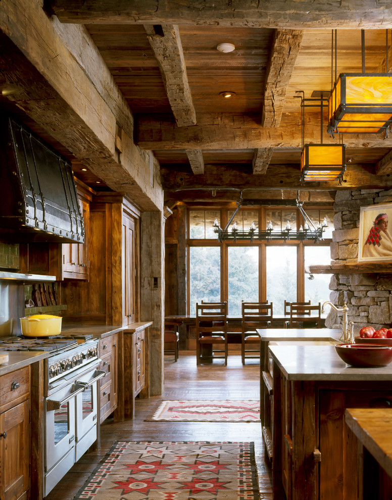 Inspiration for a rustic kitchen remodel in Other with a farmhouse sink and distressed cabinets