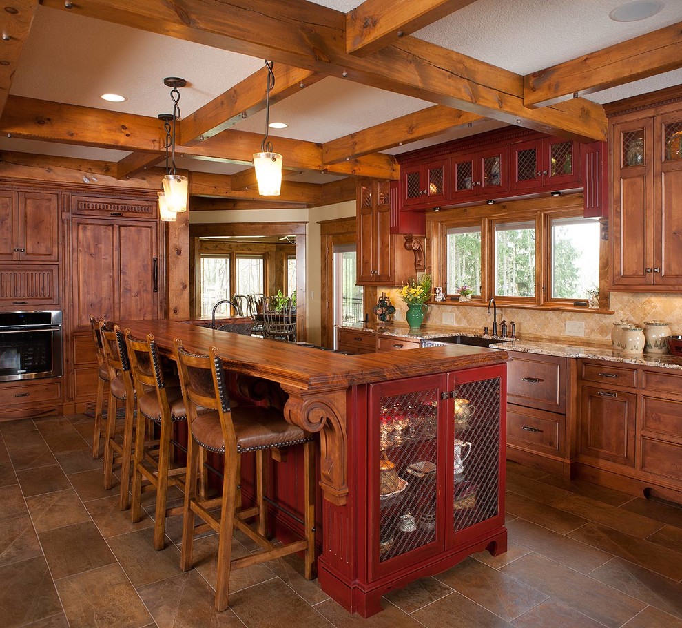 This is an example of a rustic kitchen in Cleveland with a submerged sink, recessed-panel cabinets, dark wood cabinets, granite worktops, beige splashback and stainless steel appliances.