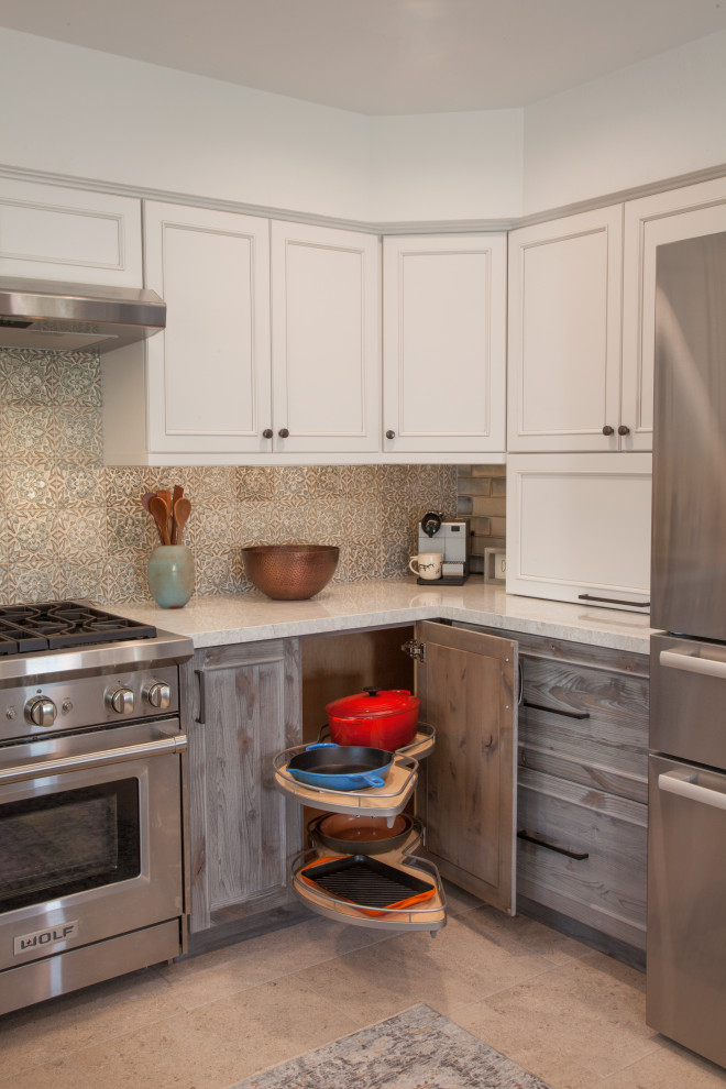 Medium sized traditional u-shaped kitchen/diner in San Diego with a submerged sink, shaker cabinets, distressed cabinets, engineered stone countertops, blue splashback, ceramic splashback, stainless steel appliances, porcelain flooring, a breakfast bar, white floors and white worktops.