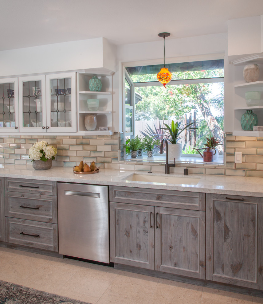 Inspiration for a mid-sized transitional u-shaped porcelain tile and white floor eat-in kitchen remodel in San Diego with an undermount sink, shaker cabinets, distressed cabinets, quartz countertops, blue backsplash, ceramic backsplash, stainless steel appliances, a peninsula and white countertops