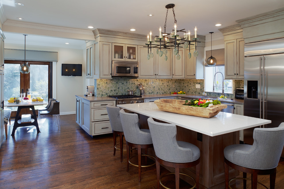 Eat-in kitchen - contemporary medium tone wood floor eat-in kitchen idea in Philadelphia with an island, beaded inset cabinets, blue cabinets, quartz countertops, green backsplash, glass sheet backsplash, stainless steel appliances and an undermount sink