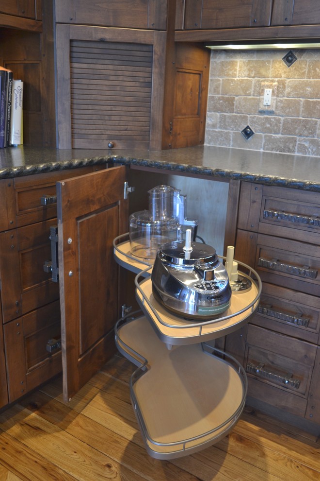 This is an example of a rustic kitchen in Other with a belfast sink and integrated appliances.