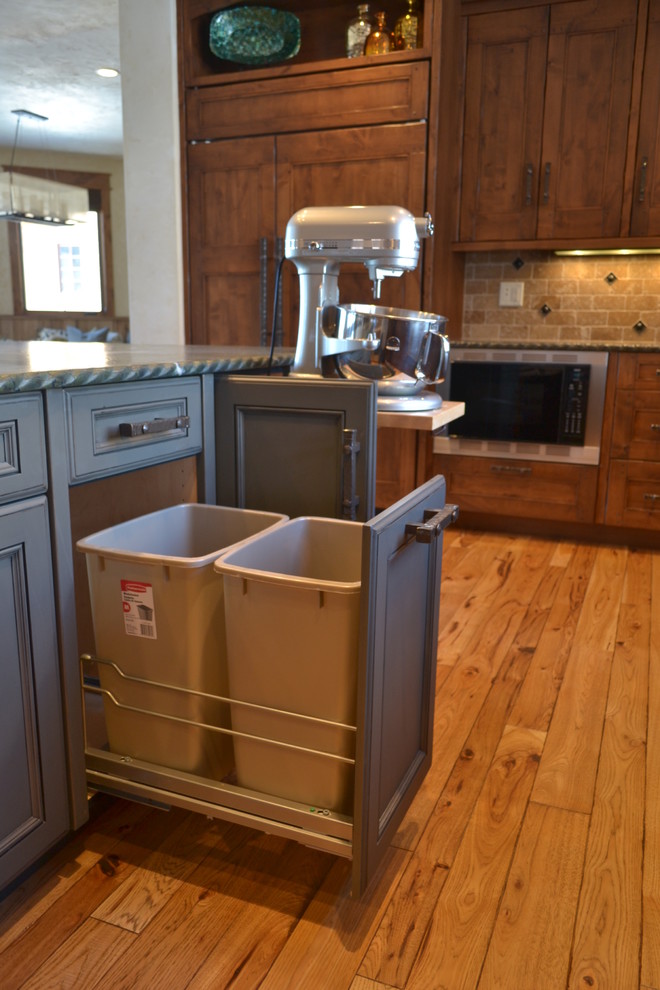 Rustic kitchen in Denver with a belfast sink and integrated appliances.