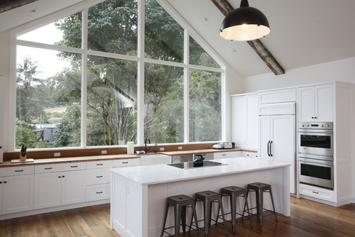 Farmhouse White Kitchen Cabinets with Wood Countertop and Large Window Design