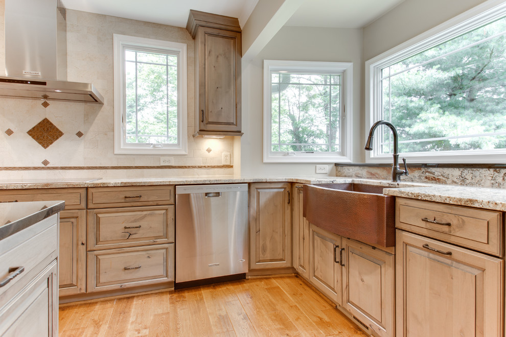 Inspiration for a rustic light wood floor and beige floor kitchen remodel in Raleigh with a farmhouse sink, raised-panel cabinets, light wood cabinets, stainless steel appliances, granite countertops, white backsplash and an island