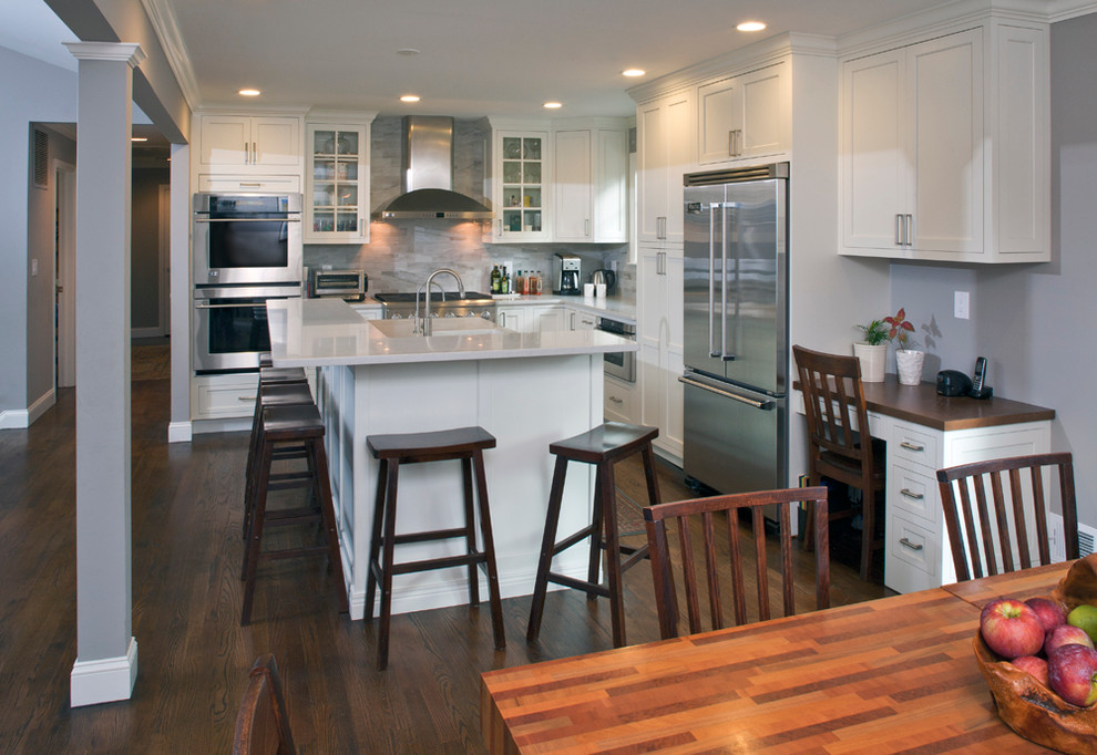 Inspiration for a transitional l-shaped open concept kitchen remodel in Other with an undermount sink, shaker cabinets, white cabinets, quartz countertops, gray backsplash, porcelain backsplash and stainless steel appliances