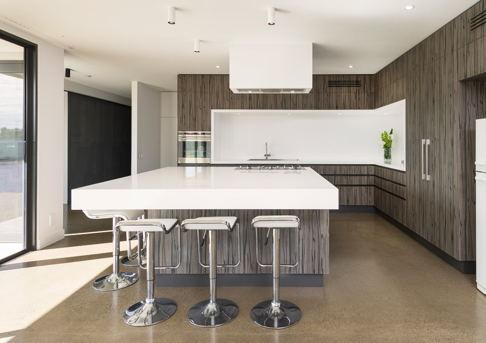 Photo of a contemporary l-shaped kitchen in Melbourne with flat-panel cabinets, grey cabinets, white splashback, integrated appliances and an island.