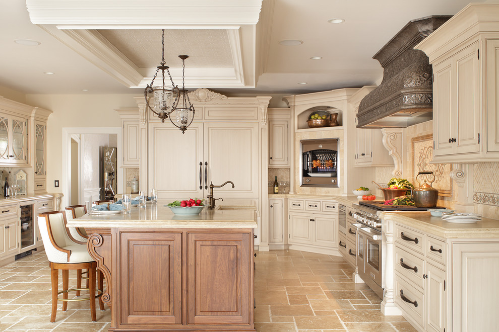 Classic l-shaped kitchen in New York with beaded cabinets, beige cabinets, beige splashback and an island.