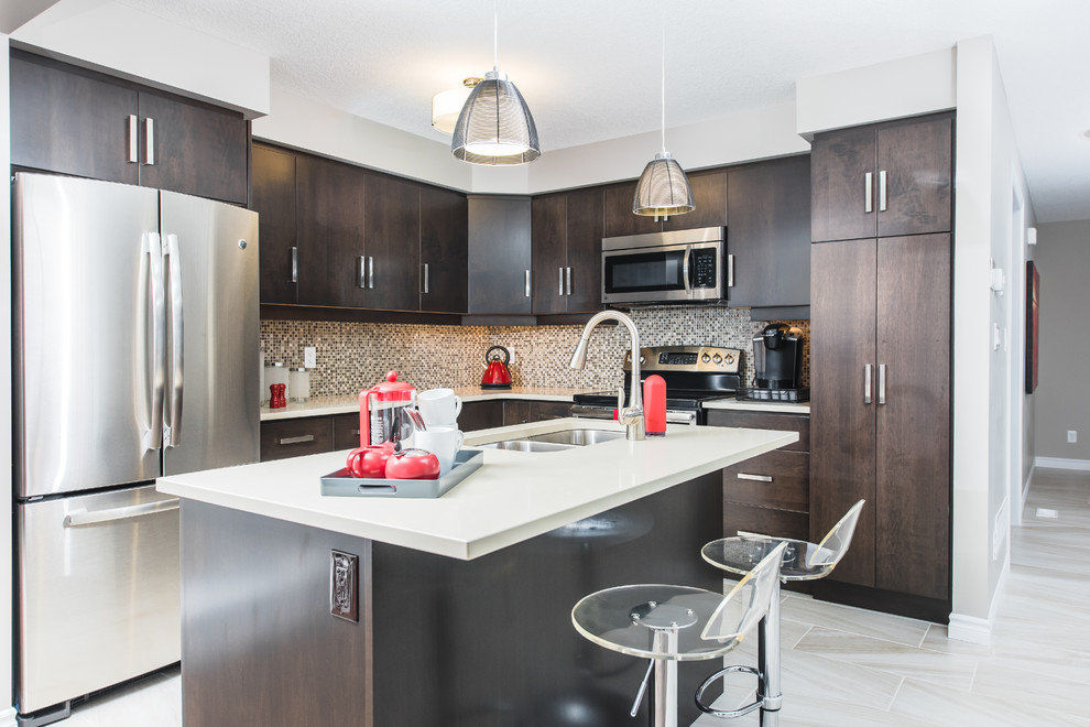 Eat-in kitchen - mid-sized transitional l-shaped ceramic tile eat-in kitchen idea in Toronto with a double-bowl sink, flat-panel cabinets, dark wood cabinets, multicolored backsplash, mosaic tile backsplash, stainless steel appliances, an island and quartz countertops