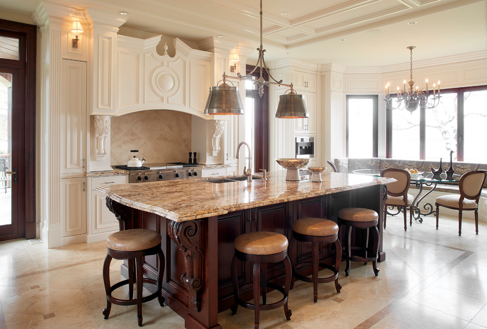 Inspiration for a timeless galley marble floor enclosed kitchen remodel in Montreal with an undermount sink, raised-panel cabinets, white cabinets, granite countertops, beige backsplash, stone tile backsplash, paneled appliances and an island