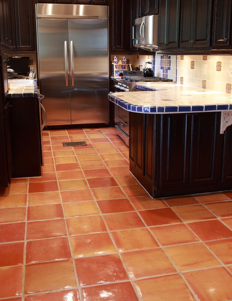 Saltillo Tile Flooring with Talavera Tile Countertop and Backsplash