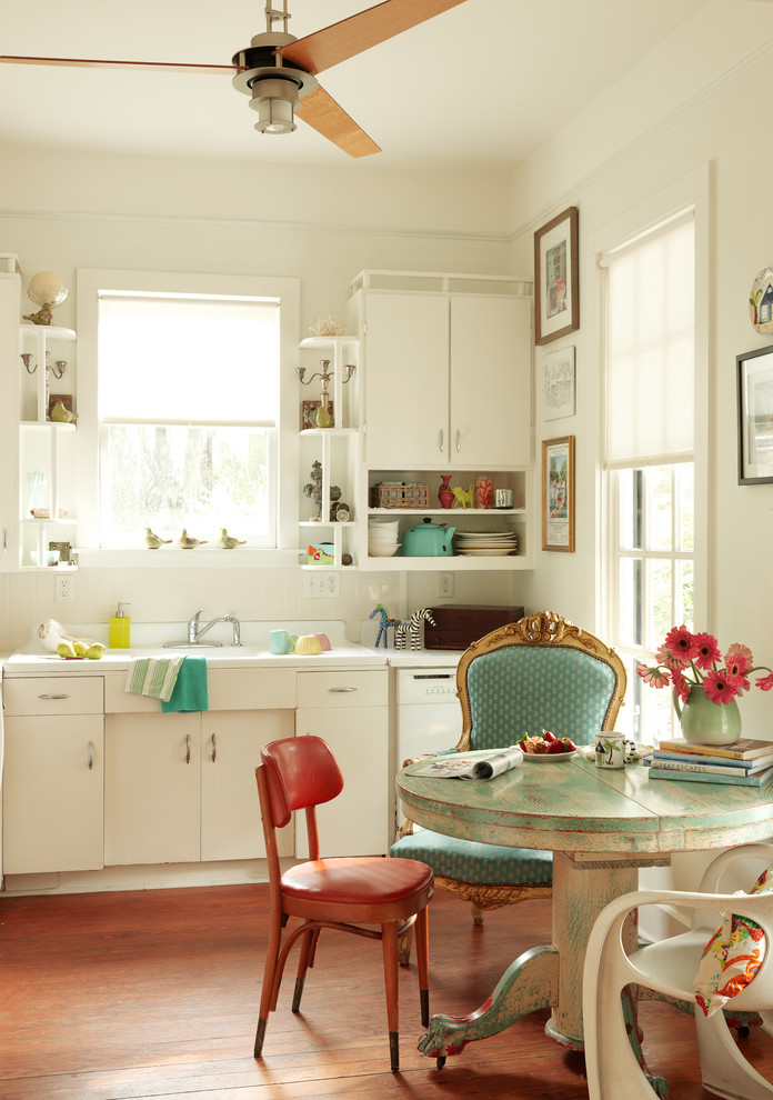 Inspiration for a shabby-chic style single-wall medium tone wood floor eat-in kitchen remodel in Burlington with flat-panel cabinets and white cabinets