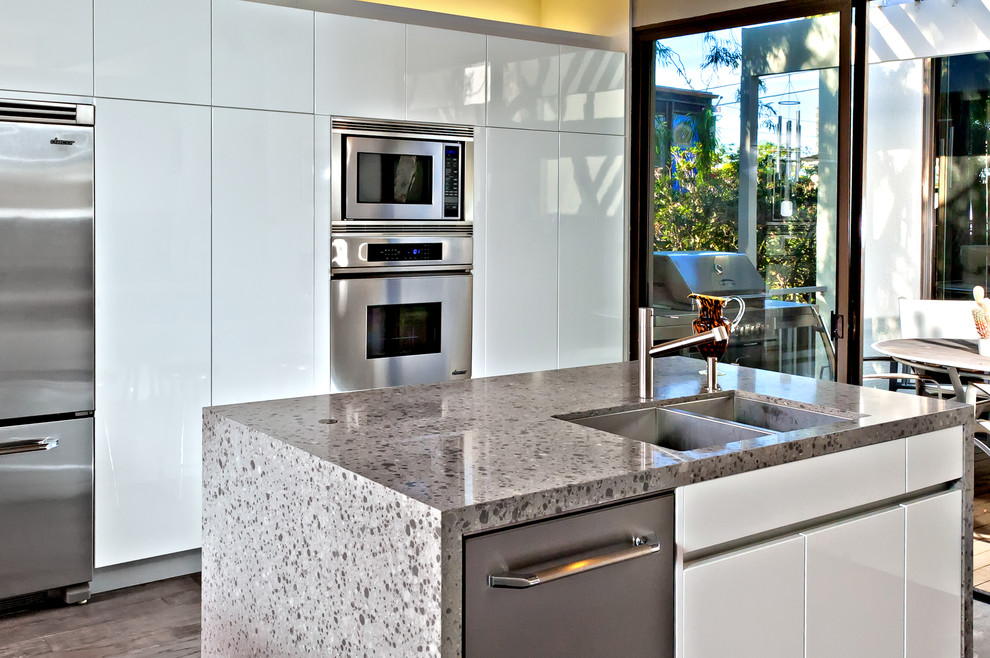 Example of a minimalist kitchen design in San Diego with stainless steel appliances
