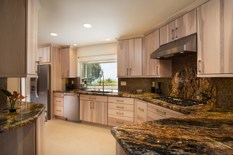 This is an example of a medium sized modern galley kitchen/diner in San Diego with a single-bowl sink, flat-panel cabinets, light wood cabinets, granite worktops, brown splashback, mosaic tiled splashback, stainless steel appliances, ceramic flooring and a breakfast bar.