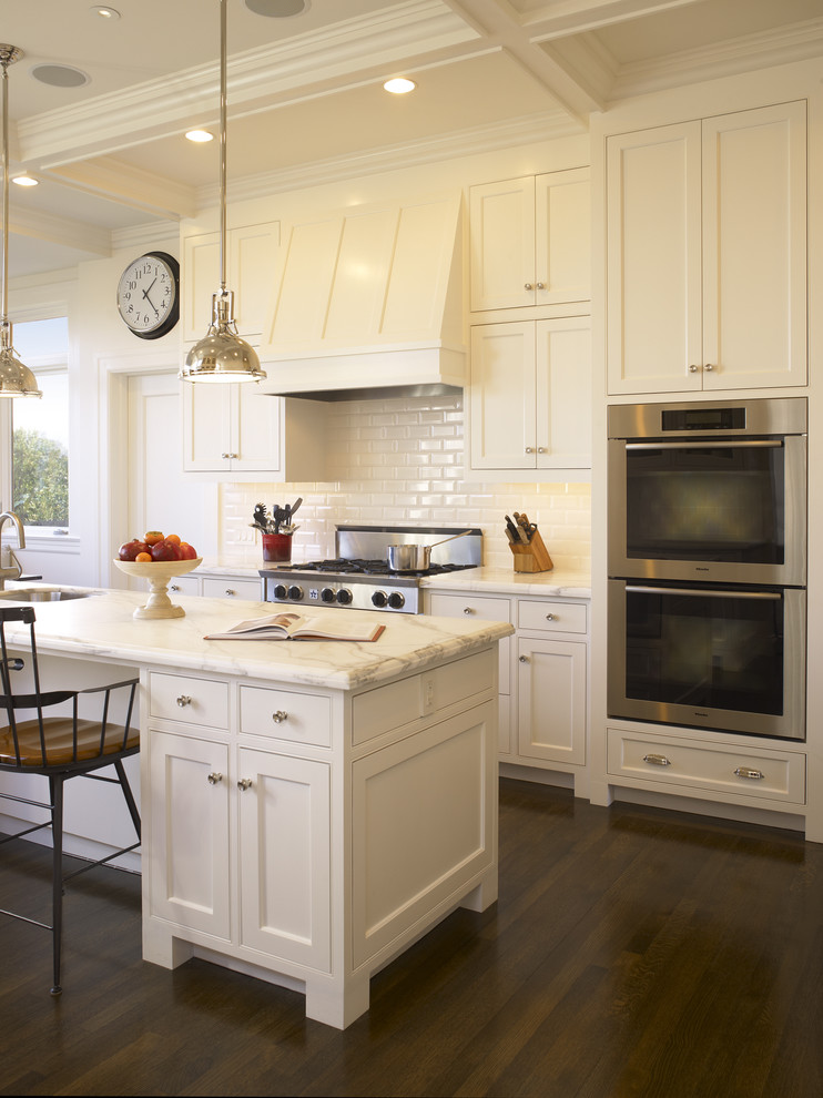Inspiration for a timeless kitchen remodel in San Francisco with beaded inset cabinets, subway tile backsplash, stainless steel appliances, white cabinets, marble countertops and white backsplash