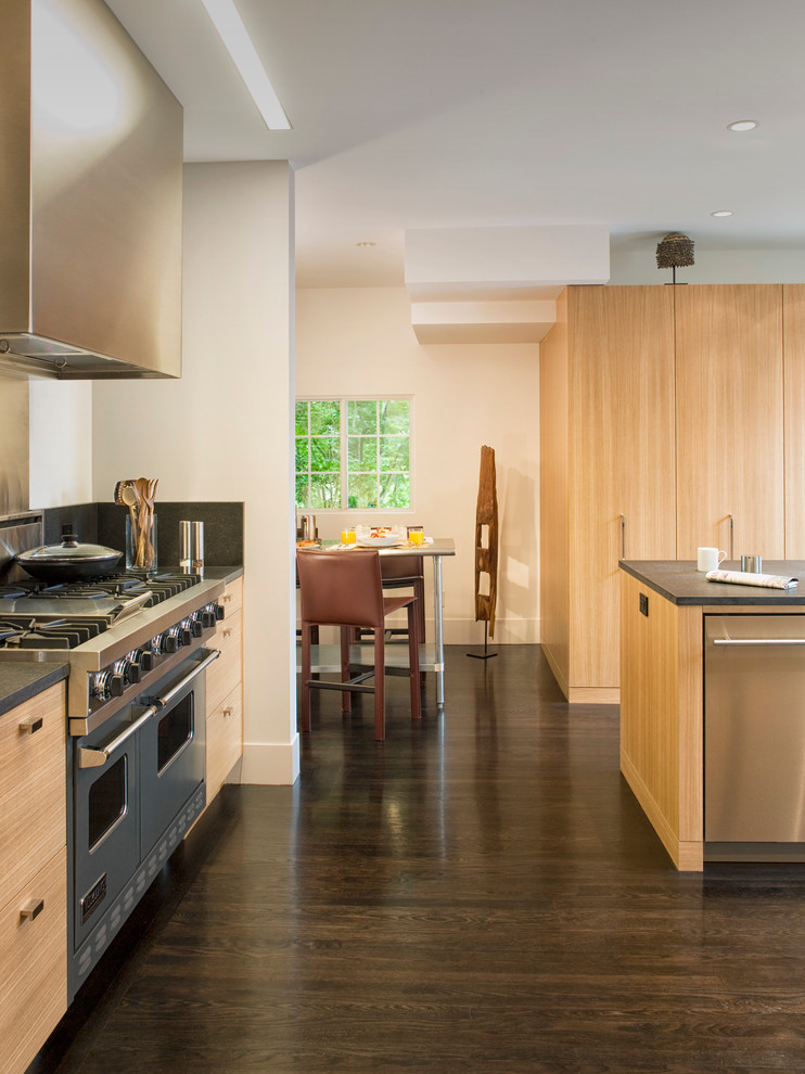 Medium sized modern galley kitchen/diner in San Francisco with an island, flat-panel cabinets, light wood cabinets, a submerged sink, brown splashback, stainless steel appliances, dark hardwood flooring, composite countertops and stone slab splashback.