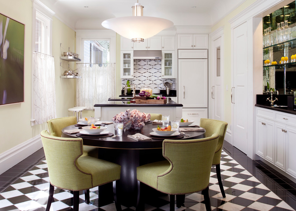 Example of a mid-sized classic l-shaped multicolored floor eat-in kitchen design in San Francisco with recessed-panel cabinets, white cabinets, paneled appliances, white backsplash, ceramic backsplash and an island
