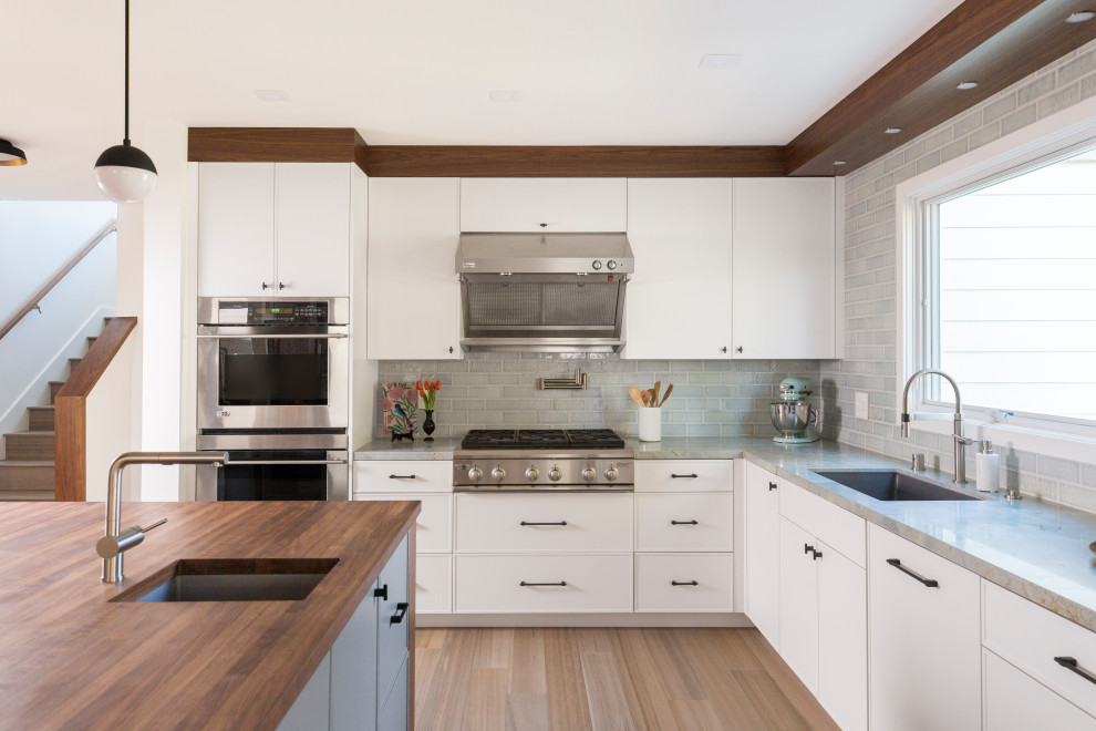 Inspiration for a modern kitchen in San Francisco with quartz worktops and an island.