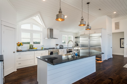 Embrace the Beach Style: White Kitchen Cabinets with Black Countertops