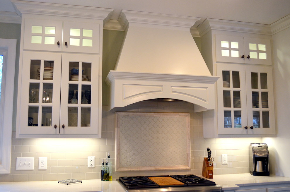 Open concept kitchen - huge traditional l-shaped dark wood floor open concept kitchen idea in Nashville with a farmhouse sink, raised-panel cabinets, white cabinets, quartz countertops, white backsplash, ceramic backsplash, stainless steel appliances and an island