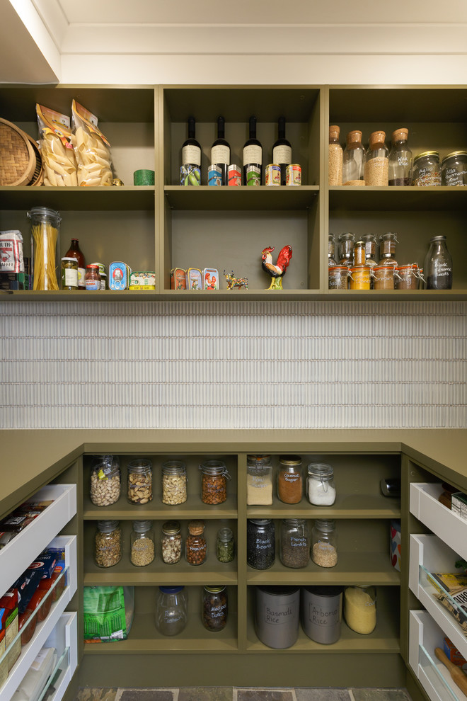 Example of a large trendy u-shaped kitchen pantry design in Melbourne with green cabinets, solid surface countertops, white backsplash, open cabinets, matchstick tile backsplash and green countertops