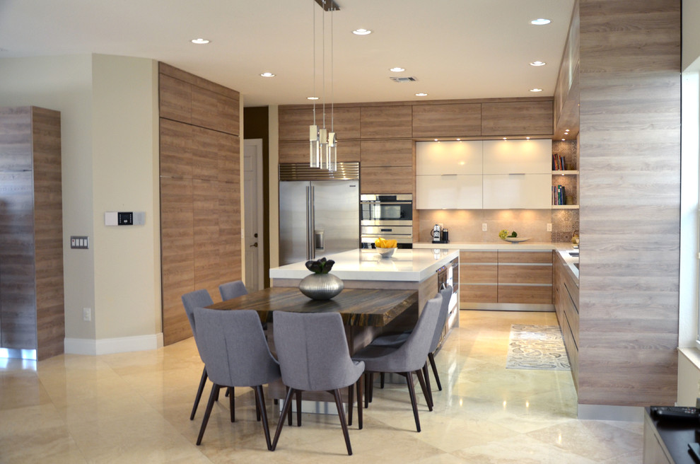 This is an example of a large contemporary u-shaped open plan kitchen in Miami with a submerged sink, flat-panel cabinets, medium wood cabinets, engineered stone countertops, grey splashback, stone tiled splashback, stainless steel appliances, porcelain flooring and an island.