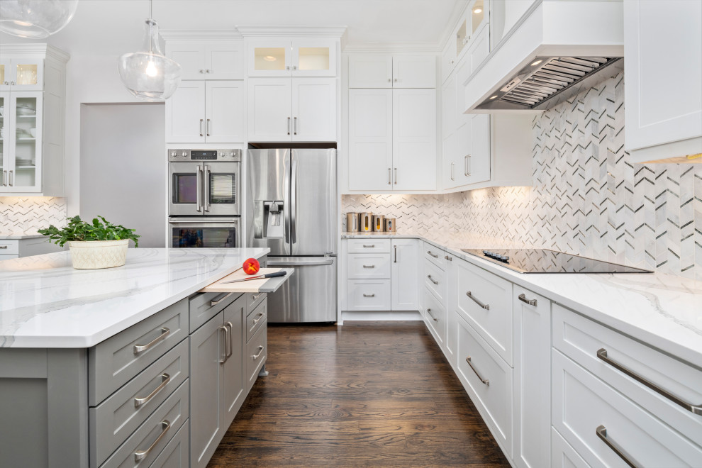 Kitchen pantry - large transitional u-shaped dark wood floor and brown floor kitchen pantry idea in Atlanta with a triple-bowl sink, shaker cabinets, white cabinets, quartzite countertops, white backsplash, marble backsplash, stainless steel appliances, an island and white countertops