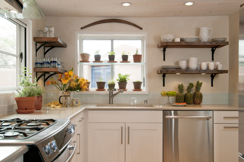 Medium sized traditional l-shaped kitchen in Albuquerque with stainless steel appliances.