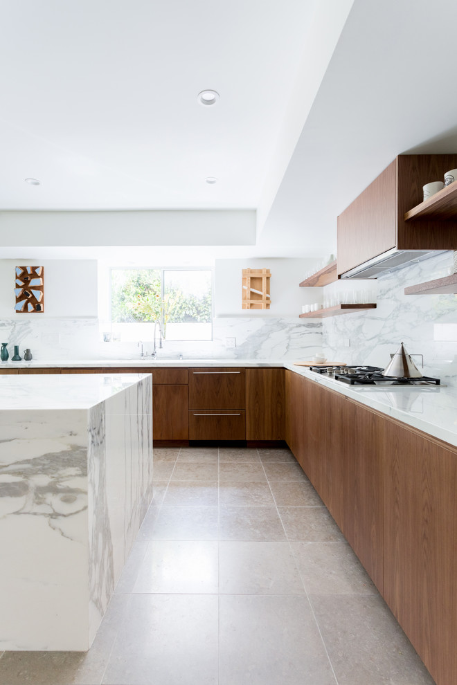 Example of a large trendy l-shaped ceramic tile and gray floor kitchen design in Los Angeles with an island, flat-panel cabinets, marble backsplash, an undermount sink, brown cabinets, marble countertops, white backsplash, paneled appliances and gray countertops