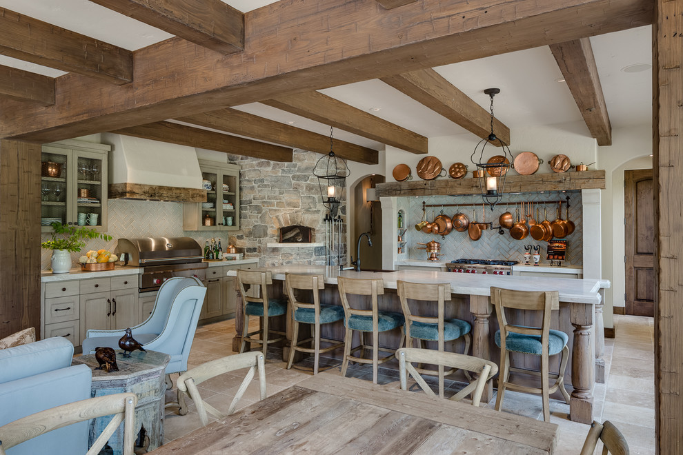 Design ideas for a traditional open plan kitchen in San Francisco with glass-front cabinets, light wood cabinets, beige splashback, stainless steel appliances and an island.