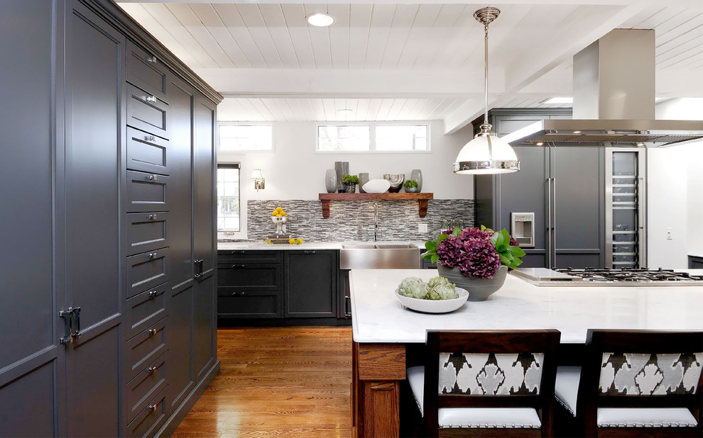 Example of a transitional kitchen design in Other with a farmhouse sink, recessed-panel cabinets, multicolored backsplash, matchstick tile backsplash and paneled appliances