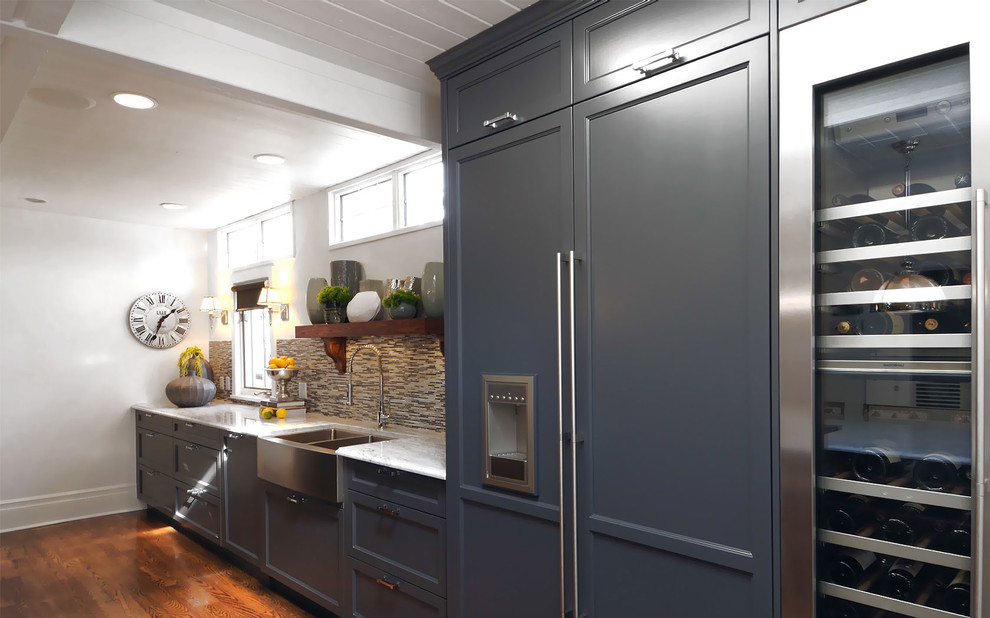 Example of a transitional kitchen design in Other with a farmhouse sink, recessed-panel cabinets, brown backsplash, matchstick tile backsplash, paneled appliances and blue cabinets