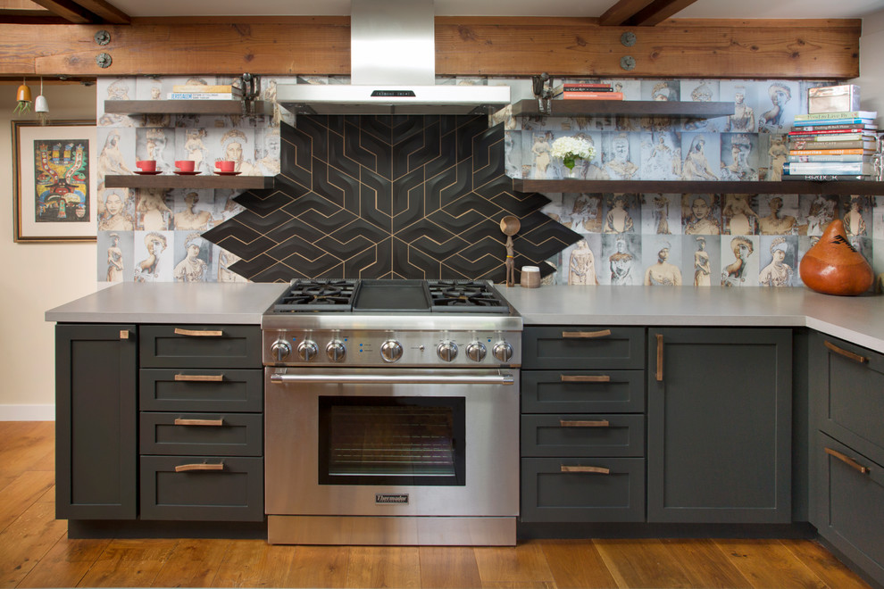 Eclectic medium tone wood floor and brown floor kitchen photo in San Francisco with shaker cabinets, gray cabinets, multicolored backsplash and stainless steel appliances