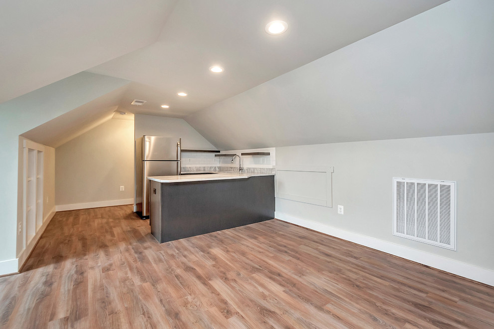 Example of a mid-sized trendy u-shaped medium tone wood floor open concept kitchen design in DC Metro with an undermount sink, shaker cabinets, brown cabinets, quartz countertops, white backsplash, subway tile backsplash, stainless steel appliances and a peninsula