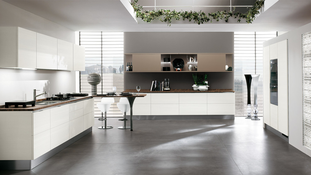 This is an example of a large modern u-shaped kitchen/diner in Melbourne with a double-bowl sink, raised-panel cabinets, white cabinets, engineered stone countertops, stainless steel appliances, concrete flooring and a breakfast bar.