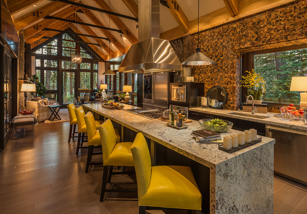 Mountain style galley medium tone wood floor open concept kitchen photo in Sacramento with an undermount sink, multicolored backsplash, mosaic tile backsplash, stainless steel appliances and an island