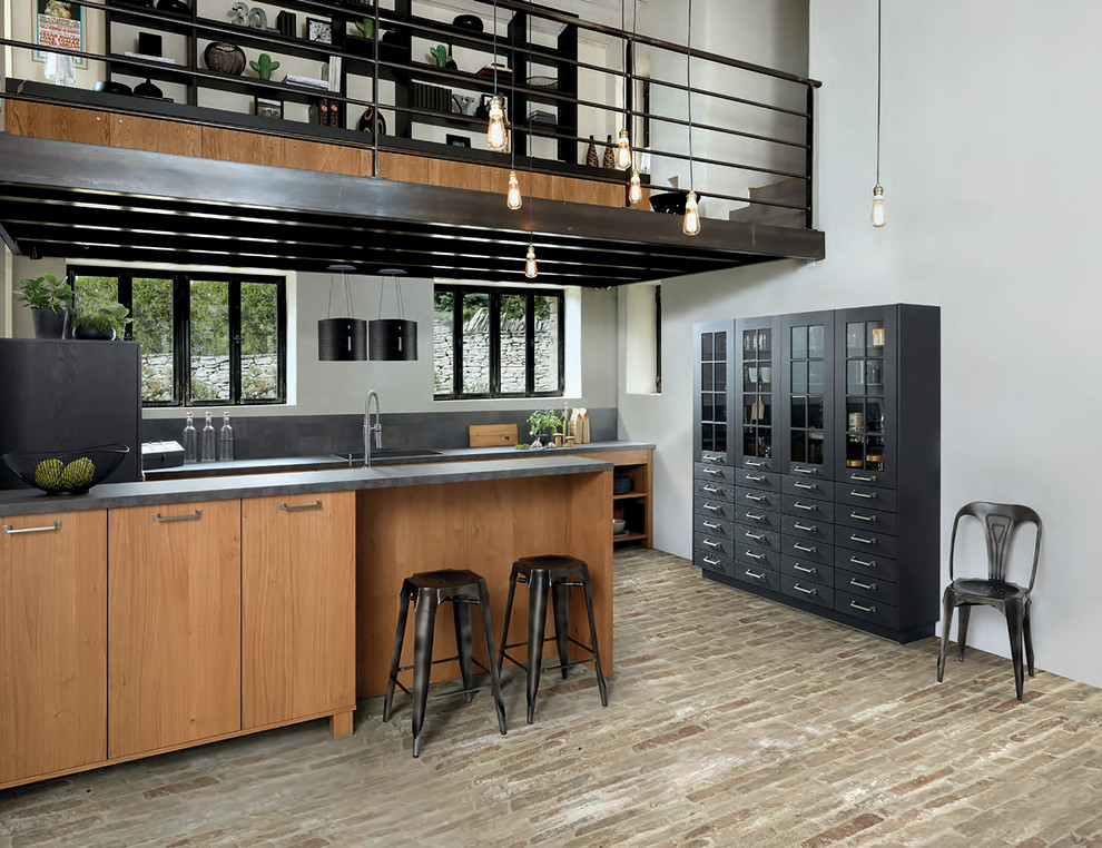 Design ideas for a contemporary galley kitchen in Other with a submerged sink, flat-panel cabinets, medium wood cabinets, grey splashback, brick flooring, a breakfast bar, brown floors and grey worktops.