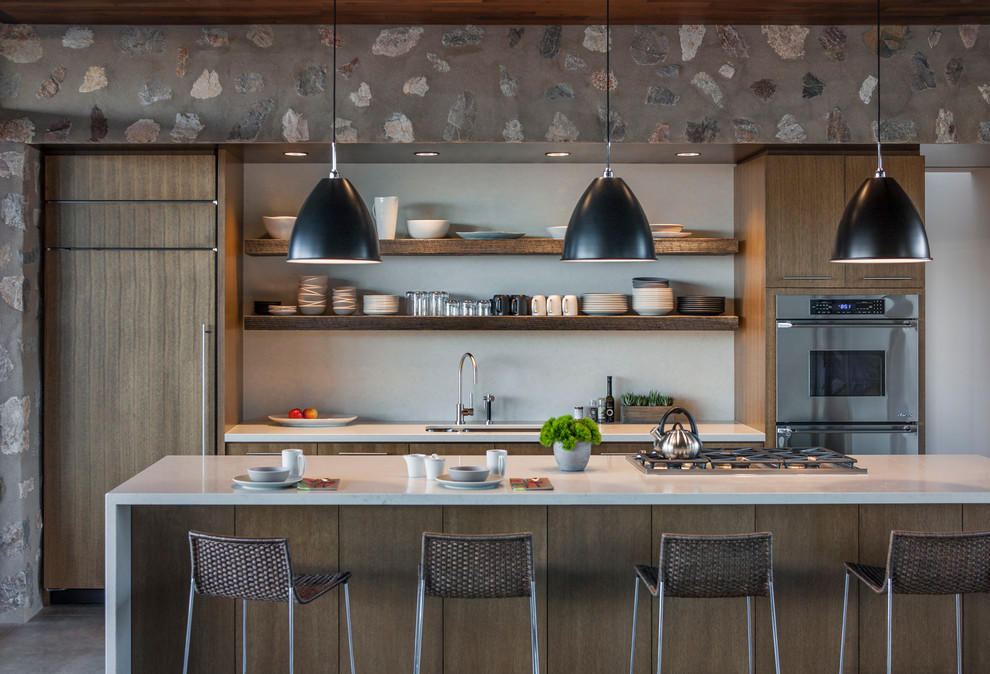 Идея дизайна: параллельная кухня-гостиная в стиле модернизм с врезной мойкой, открытыми фасадами, фасадами цвета дерева среднего тона, техникой из нержавеющей стали и бетонным полом