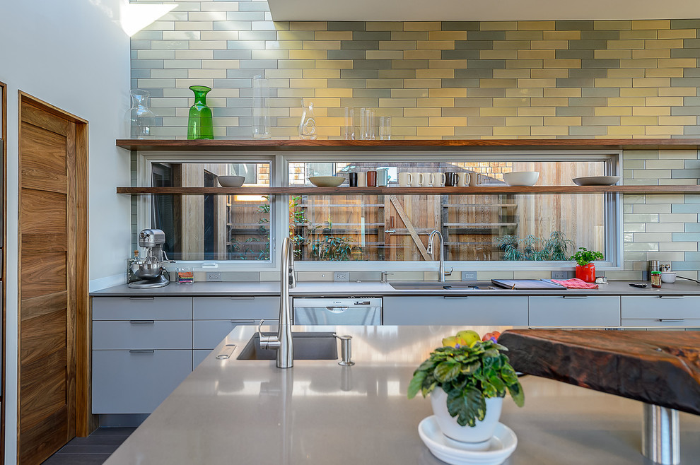 Design ideas for a midcentury galley open plan kitchen in San Francisco with stainless steel appliances.
