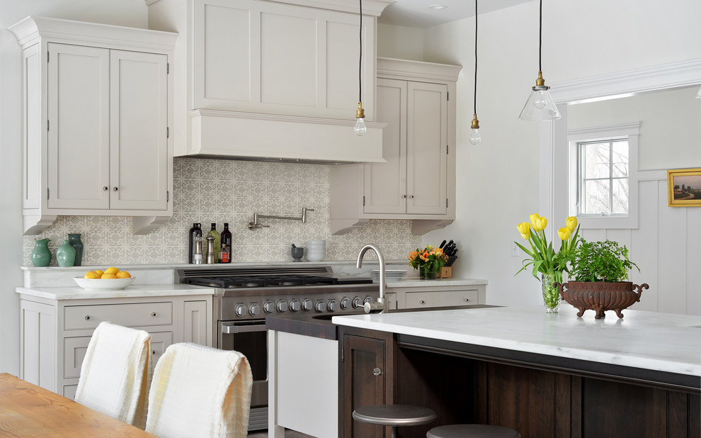 Inspiration for a transitional medium tone wood floor eat-in kitchen remodel in Atlanta with shaker cabinets, gray cabinets, stainless steel appliances and an island