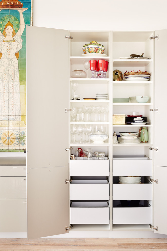 Inspiration for an expansive contemporary l-shaped open plan kitchen in Houston with flat-panel cabinets, grey cabinets, engineered stone countertops, green splashback and an island.