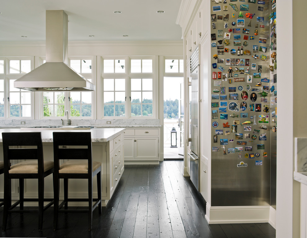 Transitional eat-in kitchen photo in Seattle with shaker cabinets, white cabinets, marble countertops, stone slab backsplash and stainless steel appliances