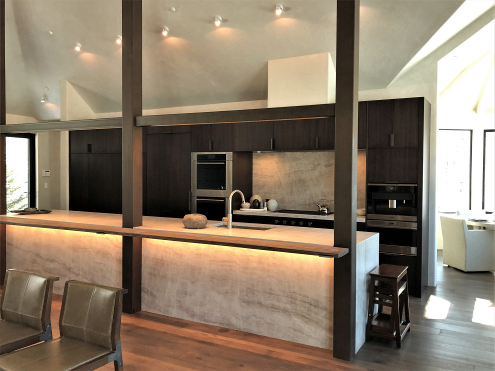 Open concept kitchen - large contemporary galley medium tone wood floor, brown floor and vaulted ceiling open concept kitchen idea in Other with an undermount sink, flat-panel cabinets, dark wood cabinets, multicolored backsplash, colored appliances, an island and multicolored countertops
