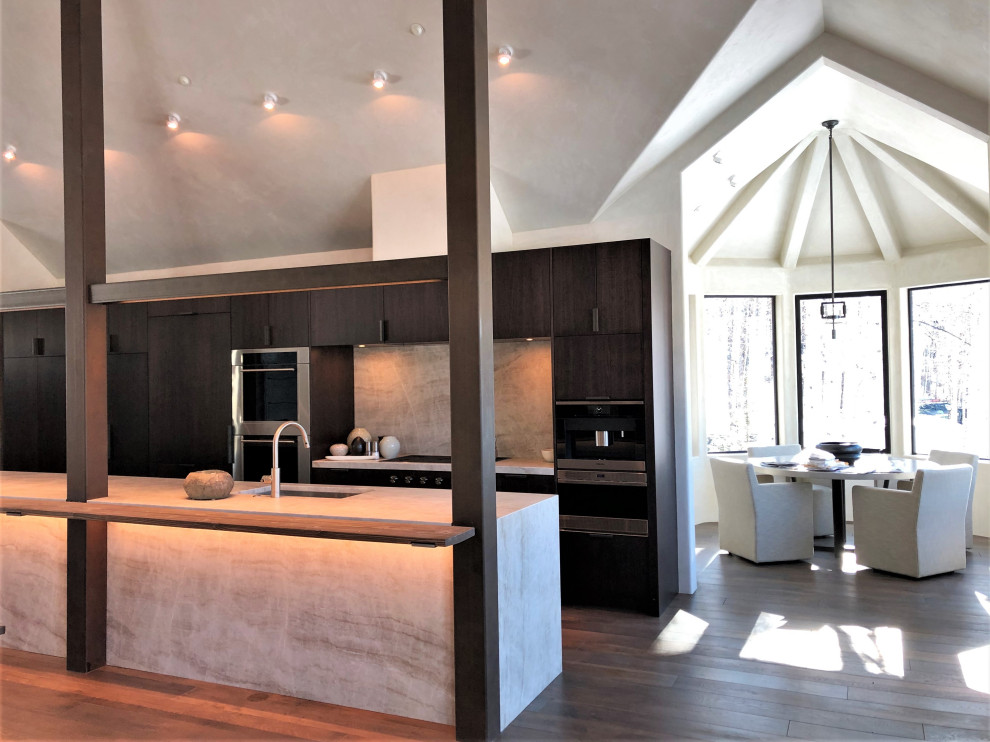 Inspiration for a large contemporary galley medium tone wood floor, brown floor and vaulted ceiling open concept kitchen remodel in Other with an undermount sink, flat-panel cabinets, dark wood cabinets, colored appliances, an island and multicolored countertops