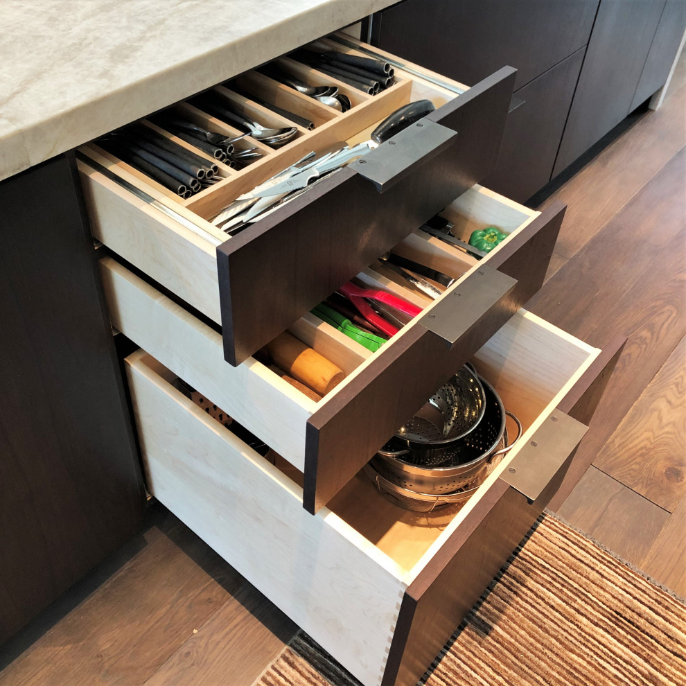 Example of a large trendy galley medium tone wood floor, brown floor and vaulted ceiling open concept kitchen design in Other with an undermount sink, flat-panel cabinets, dark wood cabinets, colored appliances, an island and multicolored countertops