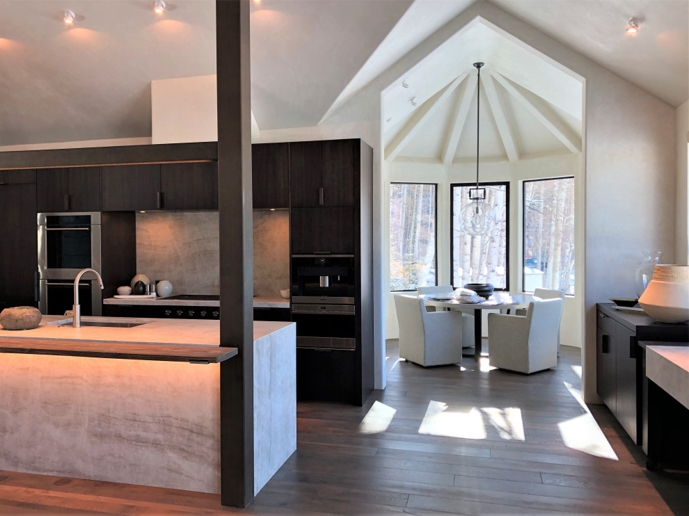 Open concept kitchen - large contemporary galley medium tone wood floor, brown floor and vaulted ceiling open concept kitchen idea in Other with an undermount sink, flat-panel cabinets, dark wood cabinets, colored appliances, an island and multicolored countertops