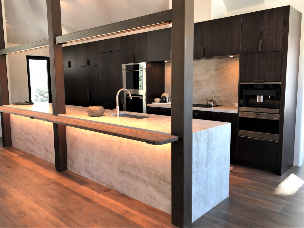 Open concept kitchen - large contemporary galley medium tone wood floor, brown floor and vaulted ceiling open concept kitchen idea in Other with an undermount sink, flat-panel cabinets, dark wood cabinets, colored appliances, an island and multicolored countertops