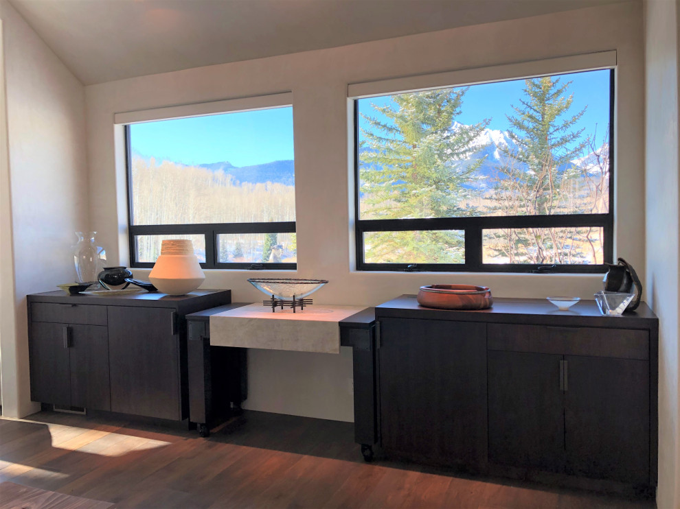 Open concept kitchen - large contemporary galley medium tone wood floor, brown floor and vaulted ceiling open concept kitchen idea in Other with an undermount sink, flat-panel cabinets, dark wood cabinets, colored appliances, an island and multicolored countertops
